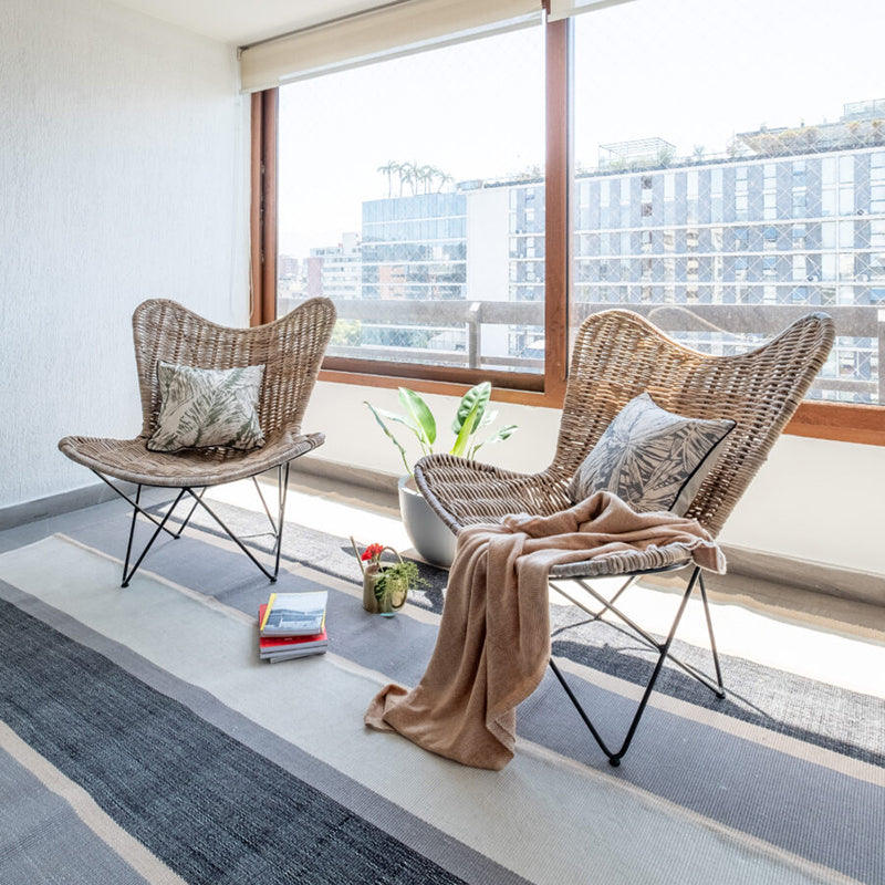 Contemporary Scandinavian Handwoven Rattan Lounge Chair - Accent Chair With Ergonomic Backrest & Iron Base For Boutique Indoor & Outdoor Spaces