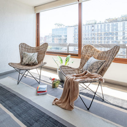 Contemporary Scandinavian Handwoven Rattan Lounge Chair - Accent Chair With Ergonomic Backrest & Iron Base For Boutique Indoor & Outdoor Spaces