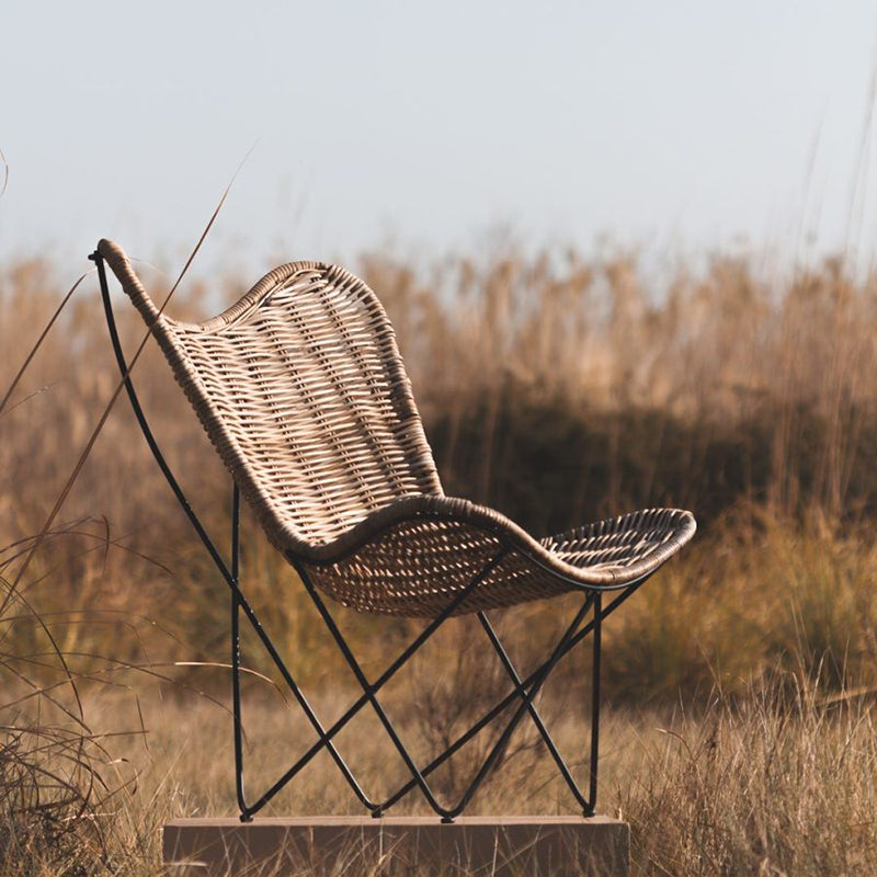 Contemporary Scandinavian Handwoven Rattan Lounge Chair - Accent Chair With Ergonomic Backrest & Iron Base For Boutique Indoor & Outdoor Spaces