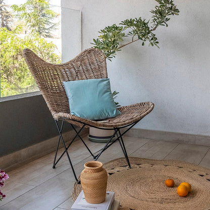 Contemporary Scandinavian Handwoven Rattan Lounge Chair - Accent Chair With Ergonomic Backrest & Iron Base For Boutique Indoor & Outdoor Spaces