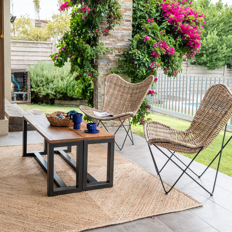 Contemporary Scandinavian Handwoven Rattan Lounge Chair - Accent Chair With Ergonomic Backrest & Iron Base For Boutique Indoor & Outdoor Spaces